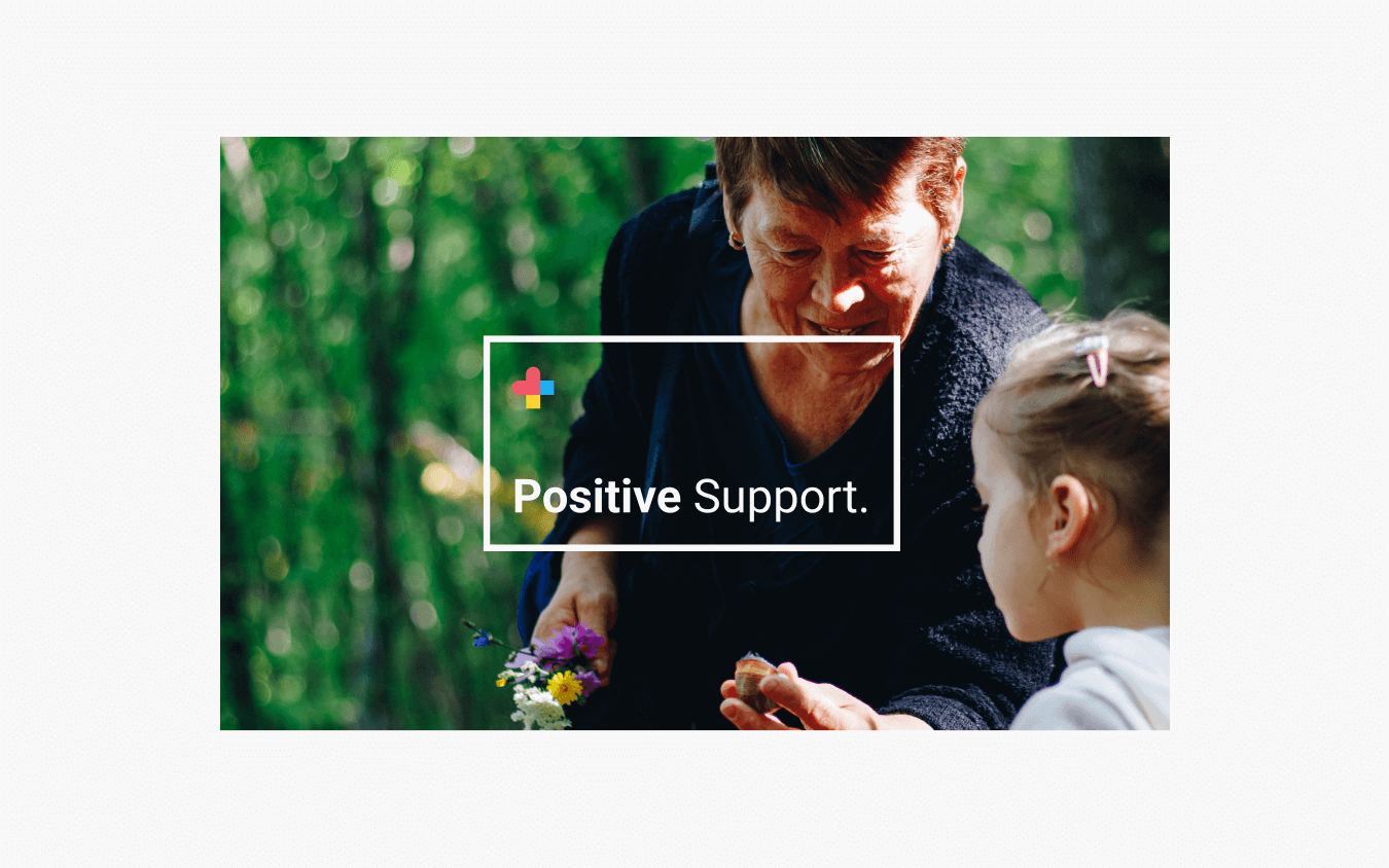 Image shows ADHD Positive banner it shows a grandmother with her grandchild outside in their garden. The grandmother shows her granddaughter a snail, and a box wraps around them, showcasing the message of positive support with the ADHD Positive Logo mark in the top left.